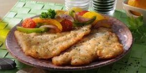 Euro Food Conrad Fisch paniert auf dem Teller mit Gemüse